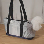 Bolsa portátil para Mascotas, con cuerpo pequeño oculto y cabeza expuesta.